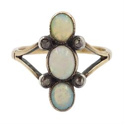 Early 20th century gold three stone opal and four stone diamond ring