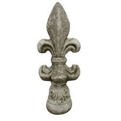 Constituted stone garden ornament in the form of a fleur-de-lis, base decorated with acanthus leaves