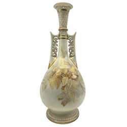Victorian Royal Worcester Persian style vase, of pear form with twin floral pierced mounted handles and lattice slender neck, hand painted and gilded with floral sprays, upon a circular moulded foot, with puce printed marks beneath including shape number 942 and date code for 1886, H43cm