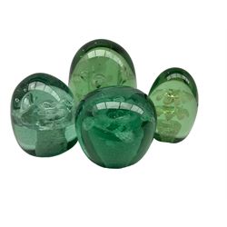 Victorian green glass dump paperweight with a flower pot inclusion H11cm, and three others of similar design (4)
