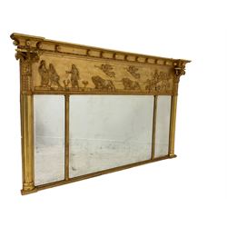 19th century gilt framed overmantle mirror, the projecting cavetto cornice decorated with large beads and repeating fish motifs, the relief frieze depicting a celebratory Roman procession scene with the goddess Magna Mater pulled in her chariot by Lions, the triple bevelled mirror plates flanked by ornate reeded columns with corinthian capitals