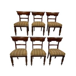 Set of six William IV mahogany dining chairs, the shaped cresting rail over seat upholstered in chequered fabric, raised on turned and reeded supports, together with a pair of Victorian chairs in similar design with drop in seat pad 