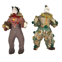 Two GH French Toy Company Pierrot dolls, the first modelled as a chimney sweep wearing a gingham shirt with pompoms, tweed trousers and leather shoes, the second in a printed cotton suit with pompoms, ruffled collar, glass eyes and leather shoes, both with painted kid leather faces and stuffed bodies, L44cm (2)