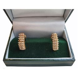 Pair of 14ct gold diamond pendant stud earrings, each earring with nine rows, each containing three round brilliant cut diamonds, stamped 585 14K 