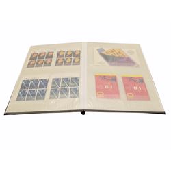 Queen Elizabeth II mint decimal stamps, housed in a stockbook, face value of usable postage approximately 190 GBP
