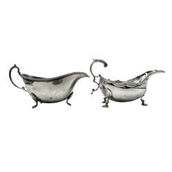 Georgian design silver sauce boat with crimped rim, 'C' scroll handle and shell supports London 1973 and another with loop handle Birmingham 1965 10oz