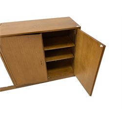 Phoenix Galleries Criterion - set three mid-20th century oak office cabinets, central cabinet with glazed sliding doors enclosing four adjustable shelves, flanked by two double cupboards concealing adjustable bookcase shelves