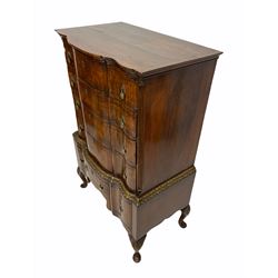 Queen Anne style walnut serpentine chest on stand, moulded cornice over four long graduated drawers with herringbone inlay, flanked by fluted canted corners, parcel gilt floral carved moulding and three drawers under, shaped apron, raised on shell carved cabriole supports W94cm, D54cm, H145cm