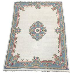 Large Indian type beige ground rug with floral decoration 368cm x 271cm