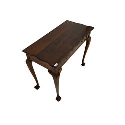 Georgian design hardwood side table, rectangular top with shaped edge, fitted with single drawer with pressed pierced brass handle plates, raised on cabriole supports with ball and claw feet