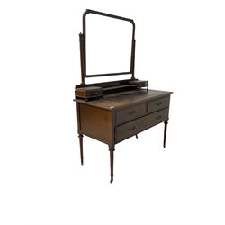 20th century mahogany mirror back dressing chest, the adjustable mirror over two short and one long drawer, raised on turned supports, terminating in brass castors W115cm