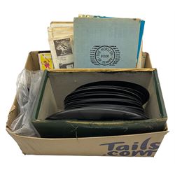 A number of 78 and 45 RPM records and two stamp albums