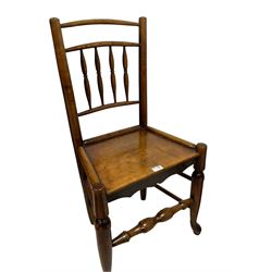 Two 19th century country Clisset chairs, the spindle back over seat, raised on turned supports, united by stretchers 