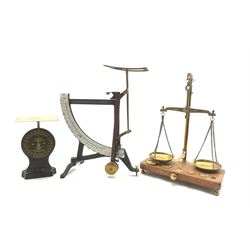 Set of brass balance scales and five weights on wooden base, set of quadrant scales with enamel register and a Salter letter balance scale No. 11