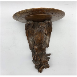 Late 19th century Black Forest wall bracket carved with an eagle and rabbit 32cm x 25cm