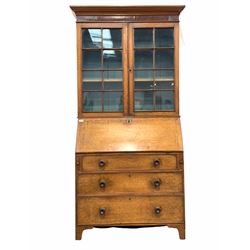 19th century bureau bookcase, the moulded cornice over mahogany banded frieze, two tracery glazed doors enclosing two shelves, fall front under revealing interior fitted with drawers and skivered writing surface over three long graduated drawers, raised on bracket supports W102cm, H219cm, D50cm