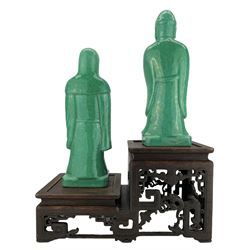 Two Chinese green crackle glazed figures depicting Lu Xing and Shou Xing, Sanxing, the gods of the three stars, H28.5cm,  displayed on a Chinese hardwood two-tier stand with fret carved bases, L32cm x H17cm