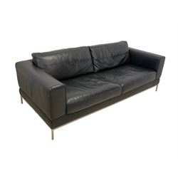 Three seat sofa upholstered in black leather, on tubular polished metal frame and feet