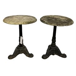 Pair of low garden tables, the circular marble top over cast iron base