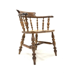 19th century yew and elm smokers bow armchair, with spindle back, saddle seat, raised on ring turned supports, the rear of the chair stamped 'J. WATSON'  W67cm