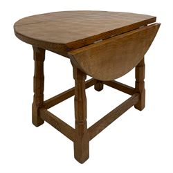 'Oakleafman' oak occasional table, adzed drop leaf top with sliding stays, splayed octagonal supports joined by stretchers, the front stretcher carved with leaf signature, by David Langstaff of Easingwold