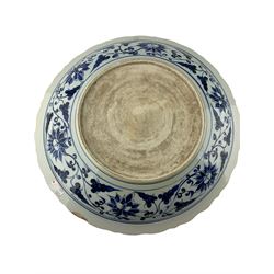 Pair of large Chinese blue and white circular shallow chargers, one centrally painted with exotic birds in a flowering tree surrounded by fruit and foliage, the other with Mandarin ducks in a lotus pond, both enclosed within a scrolling lotus border and shaped rim, D51cm 