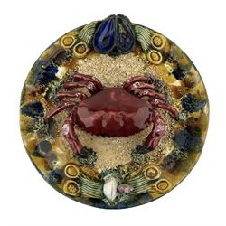 20th century Portuguese 'Palissy' majolica wall plate with a large central crab, sponged border with shells etc D32cm