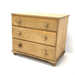 20th century pine chest of three deep drawers, with turned pull handles and bun supports, W98cm, H87cm, D62cm  