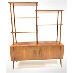 Mid 20th century teak sideboard etagere, with five open shelves on turned supports over base fitted with two doors, raised on turned tapered and splayed supports W122cm, H150cm, D38cm