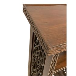 19th century walnut lectern, the sloped top with raised lip and interlacing edge decoration, the sides with pierced and carved scrolling foliate panels, fitted with single shelf, on stepped and moulded sledge feet with beaded decoration 