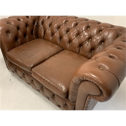  Pair of Brown leather two seat chesterfields, deep buttoned, raised on castors, W152cm  