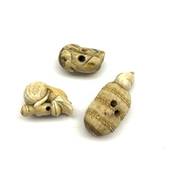 Three 19th century Japanese ivory netsukes depicting a Monkey, a Fox in clothing and a Rat upon a rice ball, the centre with a moving rat's head that appears out of a small hole in the ball (3)