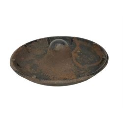 Cast iron 'Mexican hat' pig feeder or trough, circular form with central mound