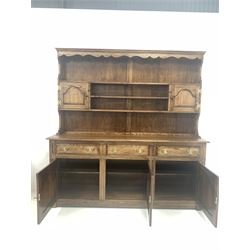 Bevan Funnel oak dresser, the plate rack with open shelves and two cupboards over three drawers and three cupboards to base, W183cm, H187cm, D46cm
