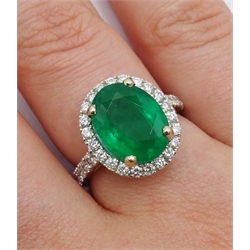  18ct white gold oval emerald and diamond ring, with diamond set shoulders, hallmarked, emerald approx 3.70 carat  