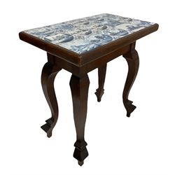 19th century Dutch walnut and mahogany side table, the associated top inset with blue and white ceramic tiles, raised on four shaped cabriole supports W67cm