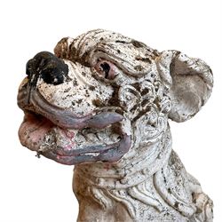 Pair of cast stone garden ornaments in for form of Dogs of Fo, with cream and polychrome painted decoration