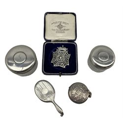 Edwardian circular silver vesta by Charles Lyster & Son, Birmingham 1907, Victorian silver cricket fob medal by S. Bros, Birmingham 1892 in matched box, together with a pair of cut glass dressing table jards with silver lids, engraved with the Case family crest, approx 2.06 ozt and a small miniature silver backed hand mirror 