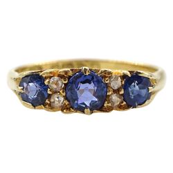 Edwardian 18ct gold three stone sapphire ring, with four diamond accents set between, makers mark S.U, Chester 1902, total sapphire weight approx 0.90 carat, boxed