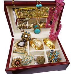 Collection of costume jewellery including two gold plated bangles, twenty-five brooches and over forty pairs of clip on earrings etc