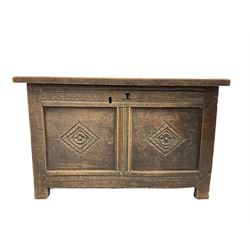 18th century oak coffer, the hinged lifting top over base with two panels with carved lozenges, raised on stile supports W82cm, H52cm, D42cm