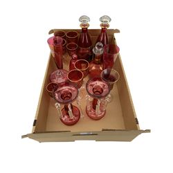 Pair of continental cranberry glass decanters with five matching wine glasses, pair of cranberry glass table lustres and other similar glass in one box