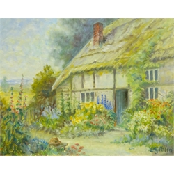 L Giblin (British 20th century): 'Cottage Garden', oil on canvas laid onto board signed, titled on artist's address label verso 40cm x 50cm