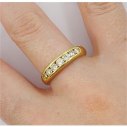 18ct gold channel set seven stone round brilliant cut diamond ring, stamped 750, total diamond weight approx 0.50 carat