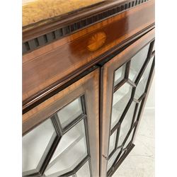 Edwardian mahogany Sheraton revival book case, the projecting cornice over two glazed doors of astragal design with satinwood bands, opening to reveal two adjustable shelves 