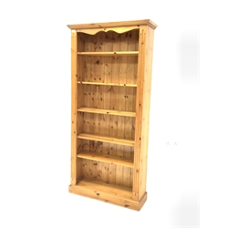  Solid pine open bookcase with fluted decoration enclosing five adjustable shelves, W89cm, H183cm, D29cm  