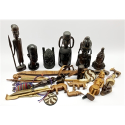  Number of African carved wood tribal figures, African sword in leather scabbard and other African items