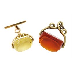 Edwardian citrine swivel fob, Birmingham 1909, with bar brooch attached stamped 9ct and a similar gilt fob set with orange glass (2)