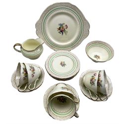 Paragon tea set pattern X2886 decorated with a centre spray within a dot border comprising six cups and saucers, six plates, milk jug, sugar bowl and bread and butter plate (21)