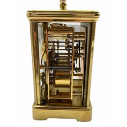 A 20th century eight-day Corniche cased striking carriage clock striking the hours and half hours on a bell, English movement with a lever platform escapement, overcoil balance spring with timing screws, eleven jewels,
white enamel dial inscribed 